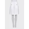 Large pleated skirt with buttons