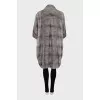 Straight-cut fur coat with a high collar