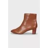 Brown leather ankle boots with a stacked heel