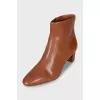 Brown leather ankle boots with a stacked heel