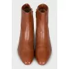 Brown leather ankle boots with a stacked heel
