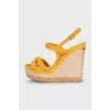 Suede sandals with a woven wedge heel
