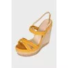 Suede sandals with a woven wedge heel