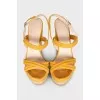 Suede sandals with a woven wedge heel