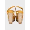 Suede sandals with a woven wedge heel