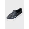 Textile slip-ons decorated with sequins