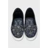 Textile slip-ons decorated with sequins
