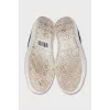 Textile slip-ons decorated with sequins