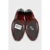 Red leather boots with embossing