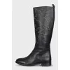 Leather boots decorated with eyelets
