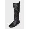 Leather boots decorated with eyelets