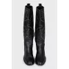 Leather boots decorated with eyelets