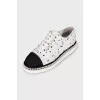 White textile sneakers with a contrasting toe