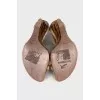 Snakeskin sandals with a gold wedge heel