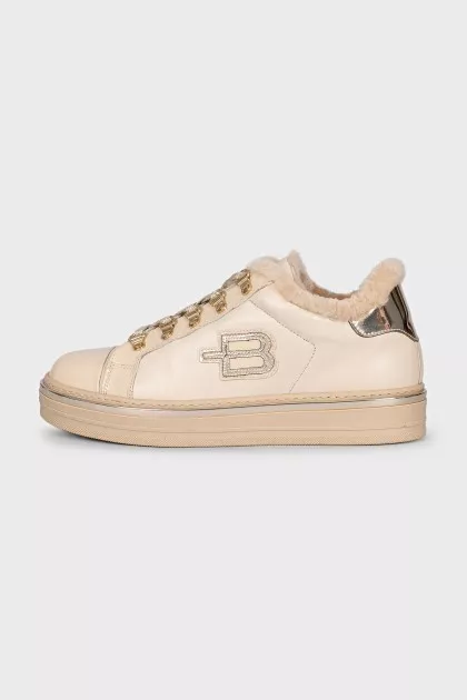 Insulated leather boots with gold-tone hardware