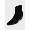 Black suede ankle boots with a stacked heel