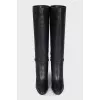 Black leather boots with gold trim