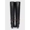 Black leather boots with gold trim
