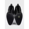 Black leather boots with gold trim