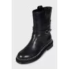 Black leather boots with silver trim