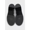 Black leather boots with silver trim