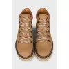 Leather boots with a logo on the back
