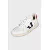 White leather sneakers with contrasting heels