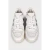 White leather sneakers with contrasting heels