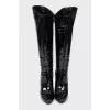 Patent leather boots with a figured heel