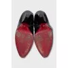 Patent leather boots with a figured heel