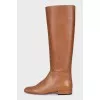 Orange boots with a zipper