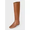 Orange boots with a zipper