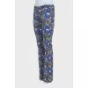 Blue flared jeans with a print