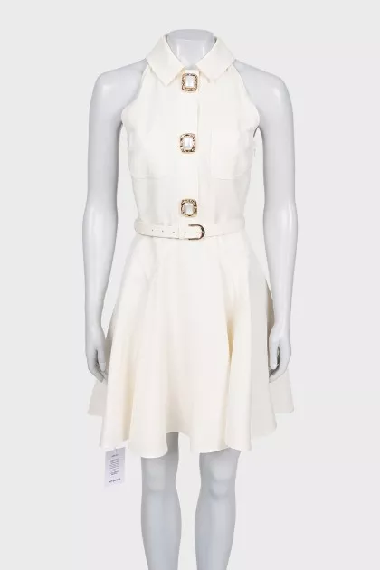 White sleeveless dress with chunky buttons