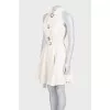 White sleeveless dress with chunky buttons