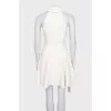 White sleeveless dress with chunky buttons