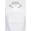 Blouse with pleats decorated with crystals