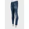Men's slim fit jeans with a ripped effect and print