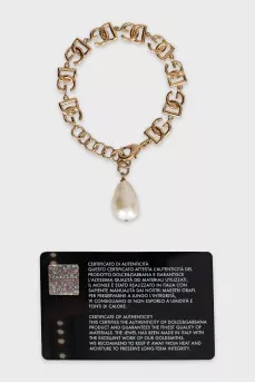 Gold bracelet with pendant