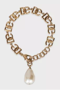 Gold bracelet with pendant