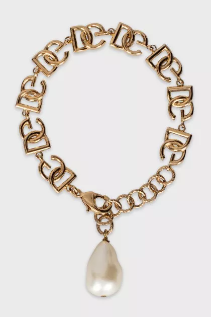 Gold bracelet with pendant