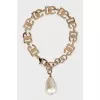 Gold bracelet with pendant