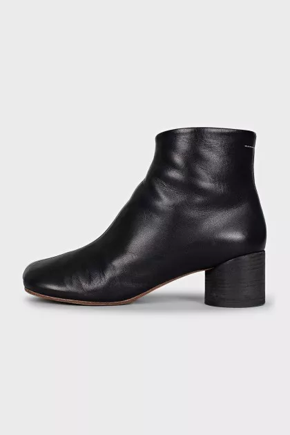 Black leather ankle boots with a square toe