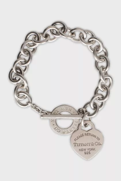 Silver bracelet with signature charm