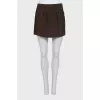 Straight mini skirt with a zipper and buttons