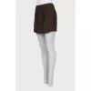Straight mini skirt with a zipper and buttons