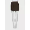 Straight mini skirt with a zipper and buttons