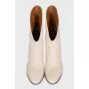 Ankle boots with a shaped top