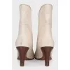 Ankle boots with a shaped top