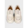Leather lace-up shoes with logo